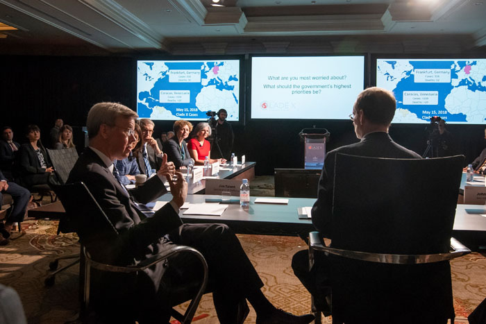 Secretary of Defense, played by Jim Talent, speaking at Clade X on May 15, 2018 in Washington, DC.
